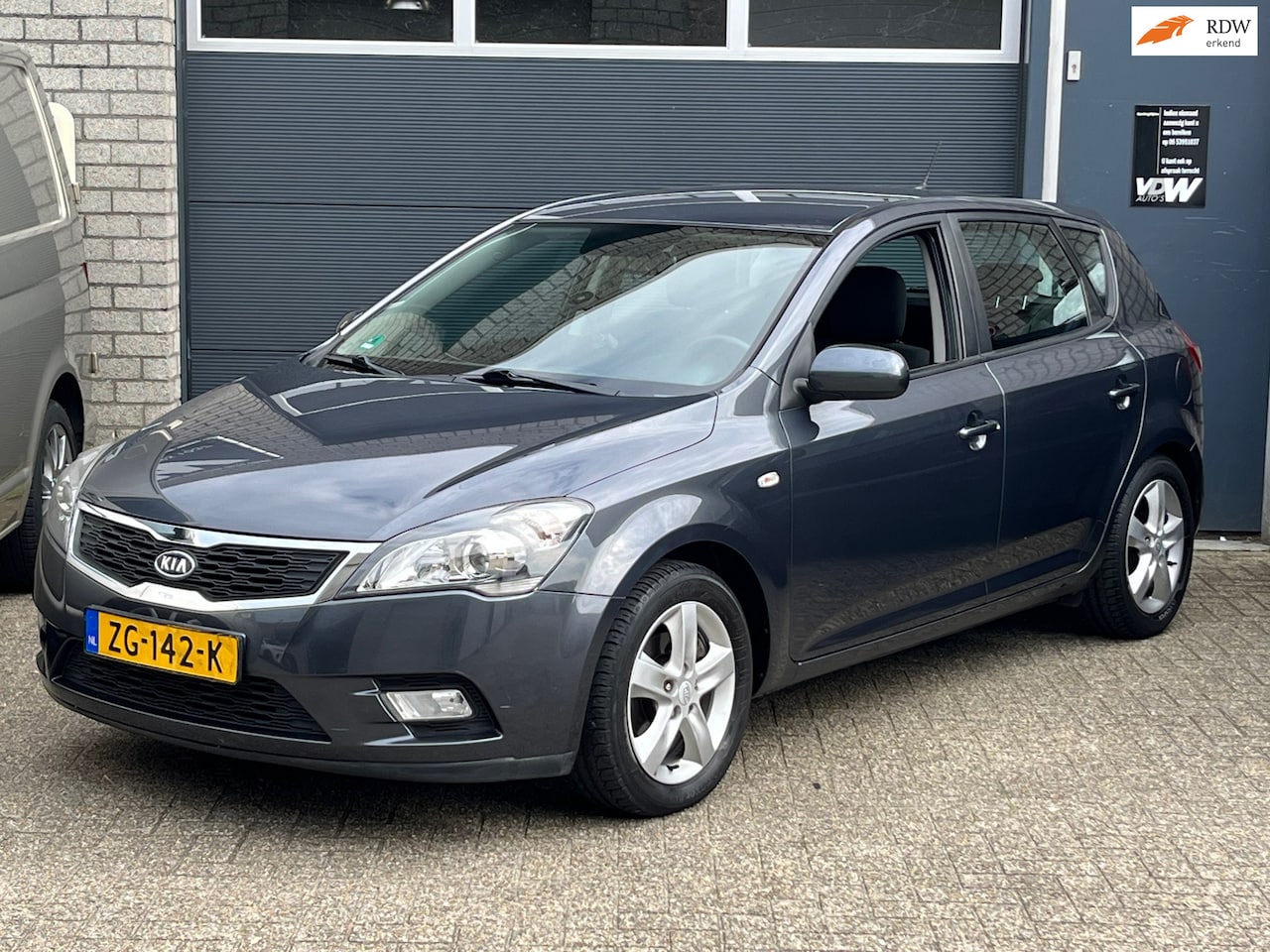 Kia Cee'd - 1.4 CVVT X-ecutive airco winterset PDC - AutoWereld.nl