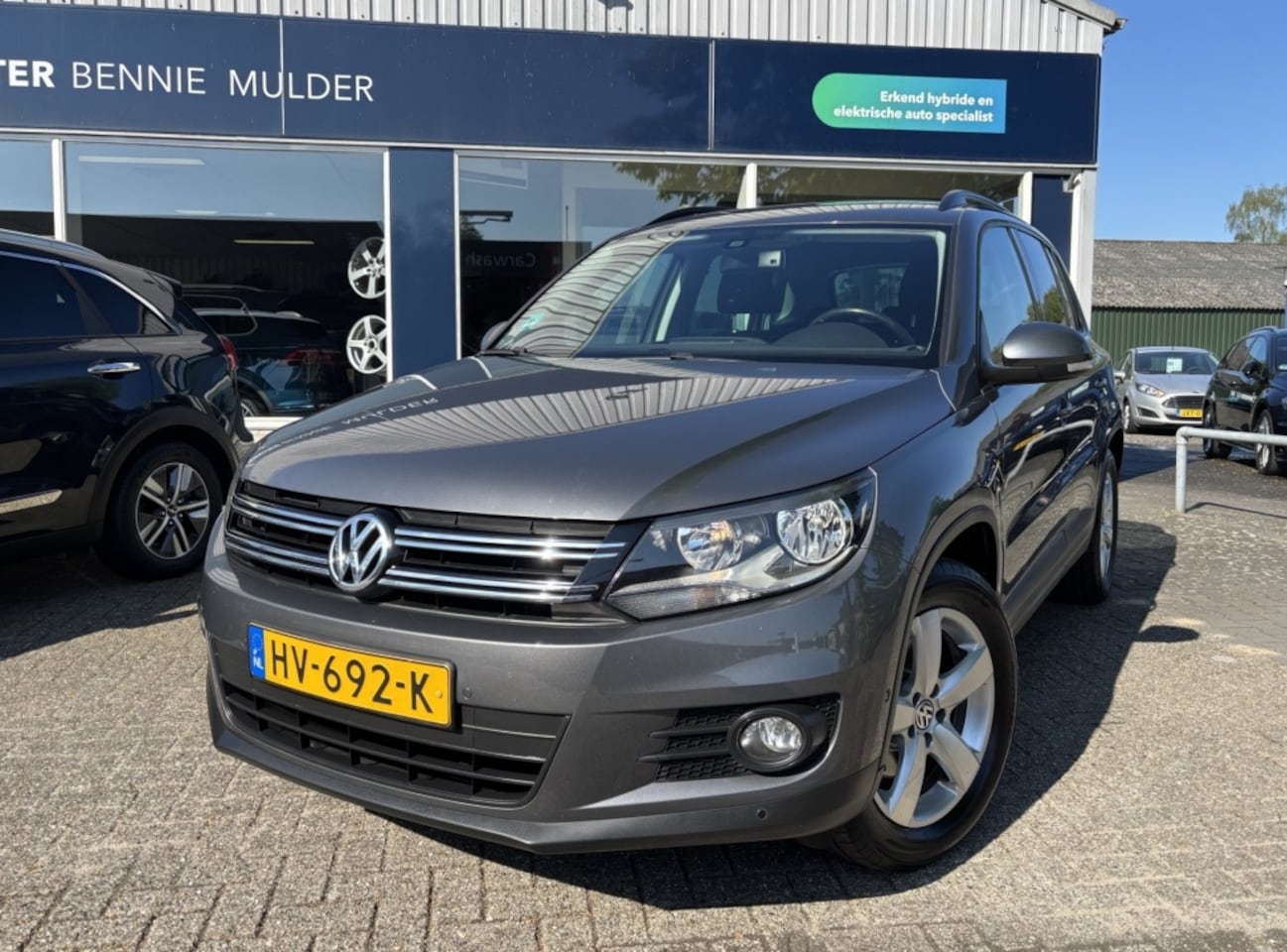 Volkswagen Tiguan - 1.4 TSI 125 PK / TREKHAAK / NAVI / PDC - AutoWereld.nl