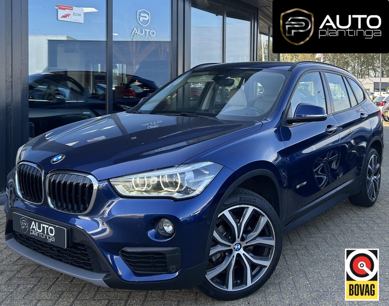 BMW X1 - sDrive18i High Executive | NL AUTO | Automaat | Achteruitrijcamera | Navigatie | Parkeerse - AutoWereld.nl