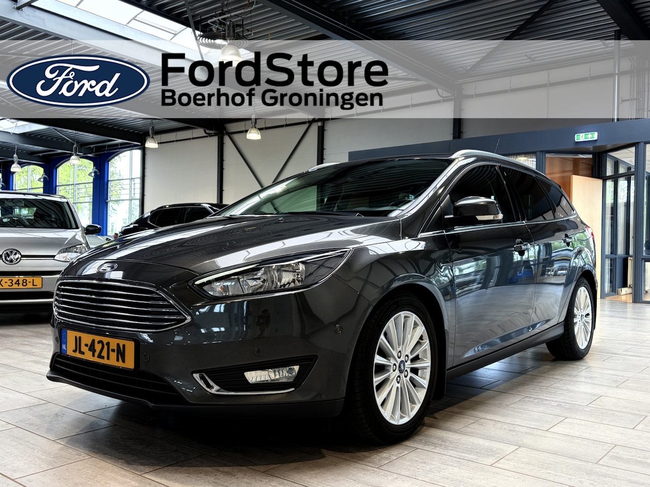 Ford Focus Wagon - EcoBoost 125 pk Titanium | Trekhaak | Voorruitverw. | Navi | Clima | Cruise | 17" | Keyles - AutoWereld.nl
