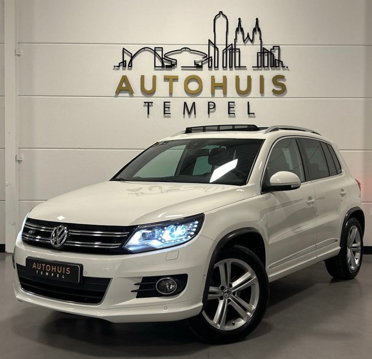 Volkswagen Tiguan - 1.4 TSI Sport&Style 4motion R-line Edition Nap Pano Cruise Climate Led Pdc Navi Trekhaak V - AutoWereld.nl