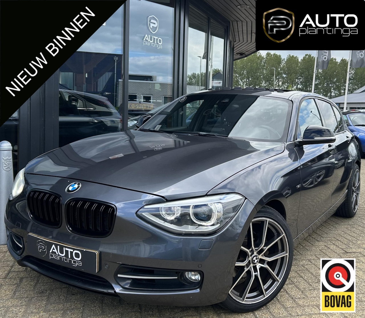 BMW 1-serie - 118i Business 170PK | AUTOMAAT | Achteruitrijcamera | Parkeersensoren | Stoelverwarming | - AutoWereld.nl