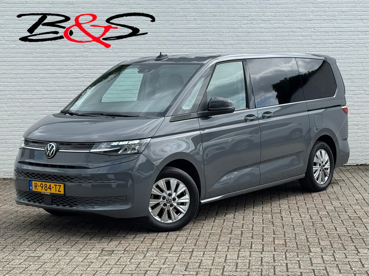 Volkswagen Multivan - 1.4 eHybrid L2H1 Trekhaak 1600kg Camera Clima Cruise Navigatie Carplay - AutoWereld.nl