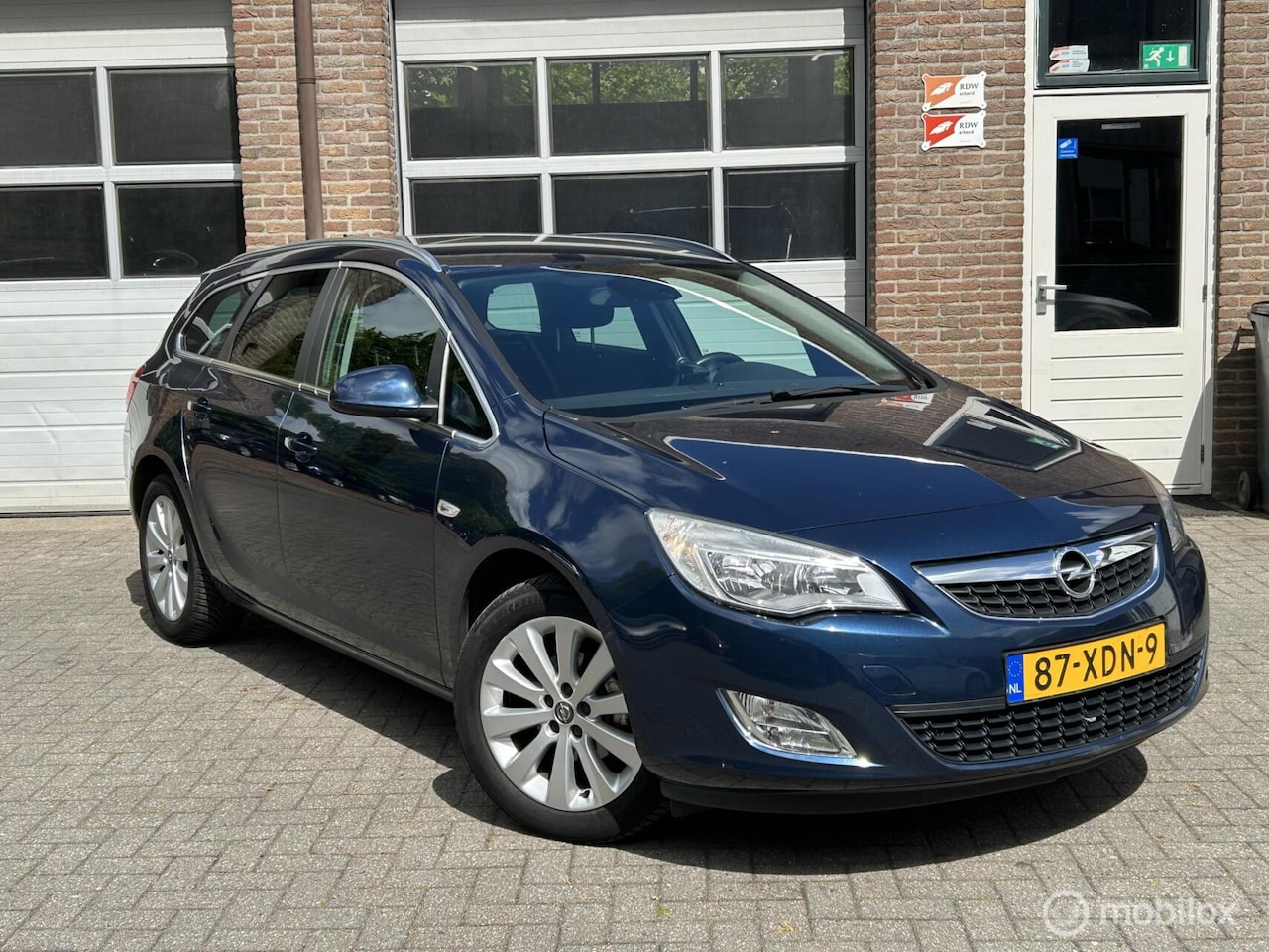 Opel Astra Sports Tourer - 1.4 Turbo Anniversary Edition 1.4 Turbo Anniversary Edition - AutoWereld.nl