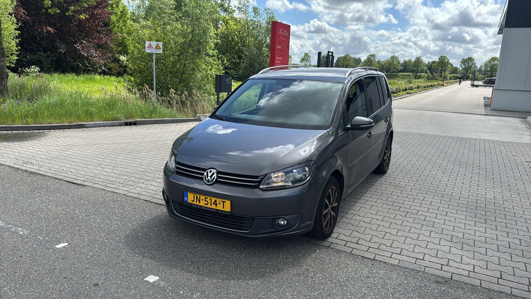 Volkswagen Touran - 1.6 TDI Highline BlueMotion HIGLINE CLIMA GRIJS 2012 - AutoWereld.nl