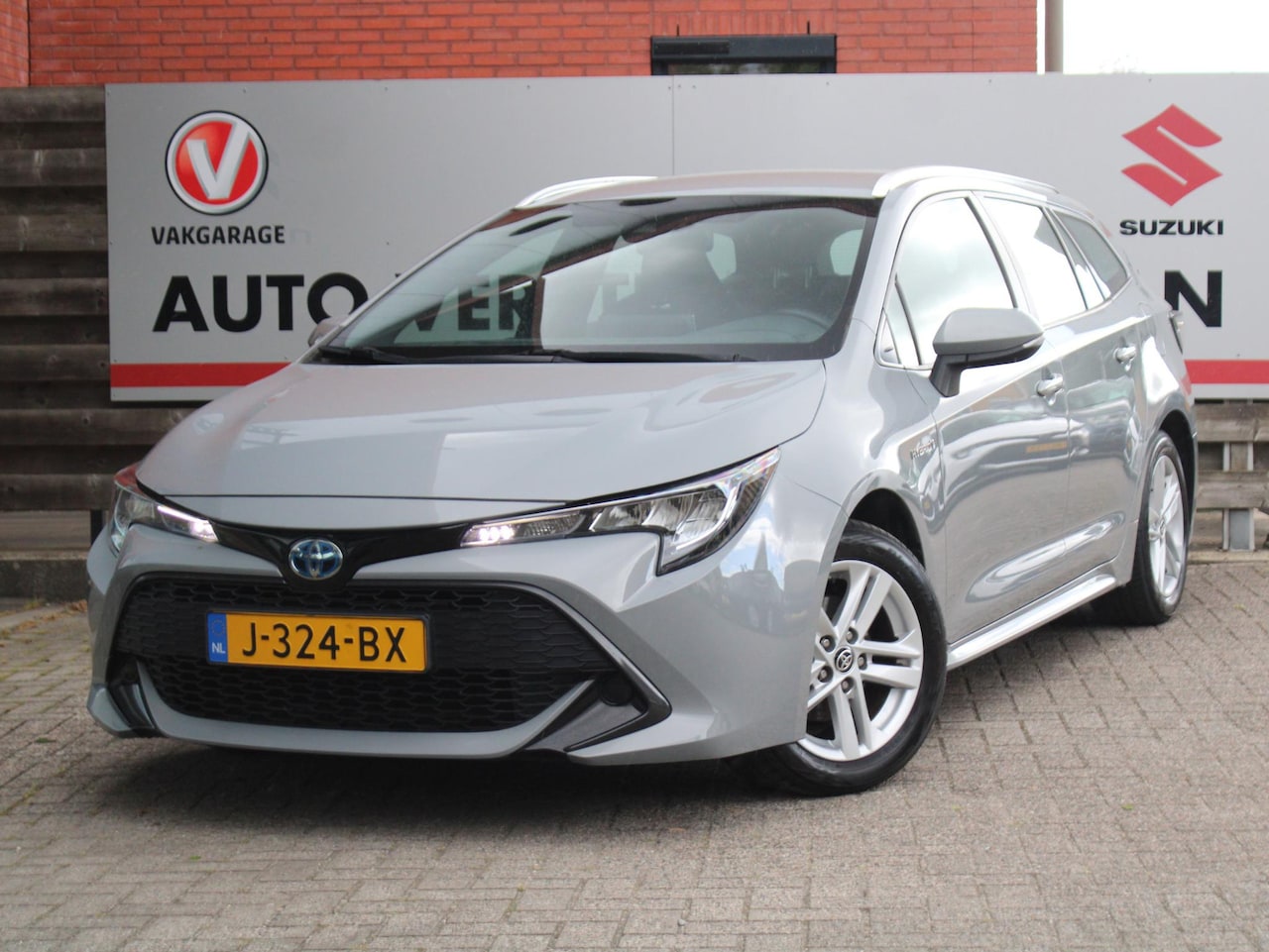 Toyota Corolla Touring Sports - 1.8 Hybrid Active Apple Carplay/Android Auto, Camera, Climate/Cruise Control - AutoWereld.nl