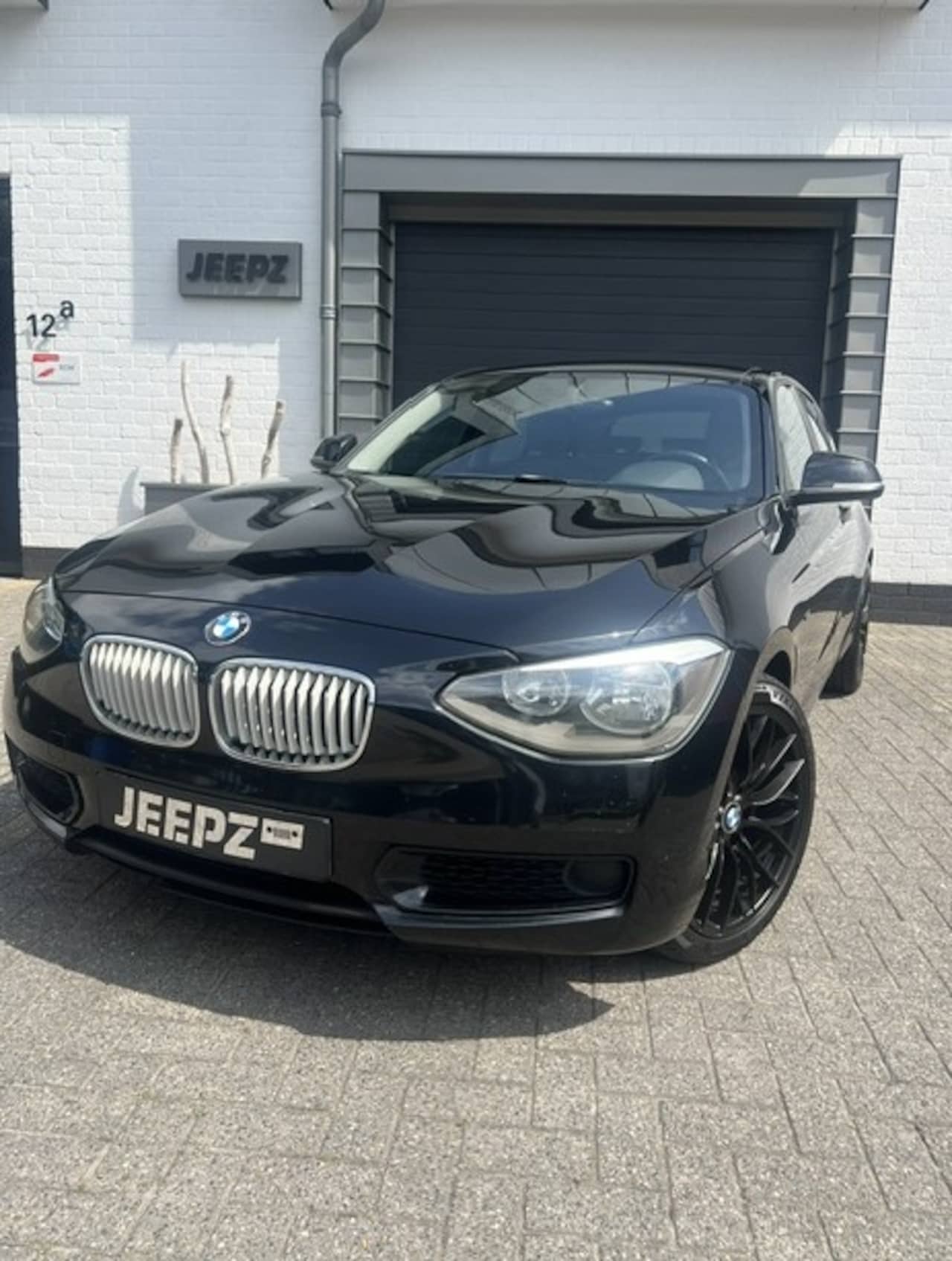 BMW 1-serie - 118i Black edition / 18 lmv - AutoWereld.nl