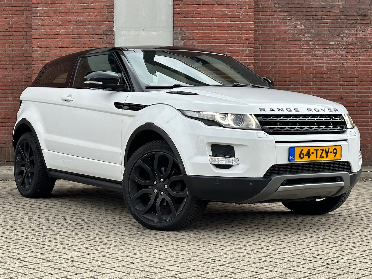 Land Rover Range Rover Evoque Coupé - 2.0 Si 4WD Prestige|AUTOMAAT|PANO|CRUISE|FULL-OPTIONS - AutoWereld.nl