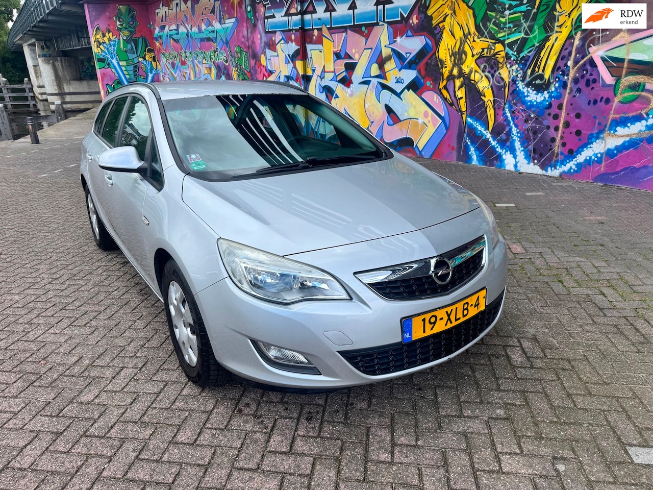 Opel Astra Sports Tourer - 1.4 Turbo LPG Edition navigatie airco elektrische ramen trekhaak goed onderhouden auto goe - AutoWereld.nl