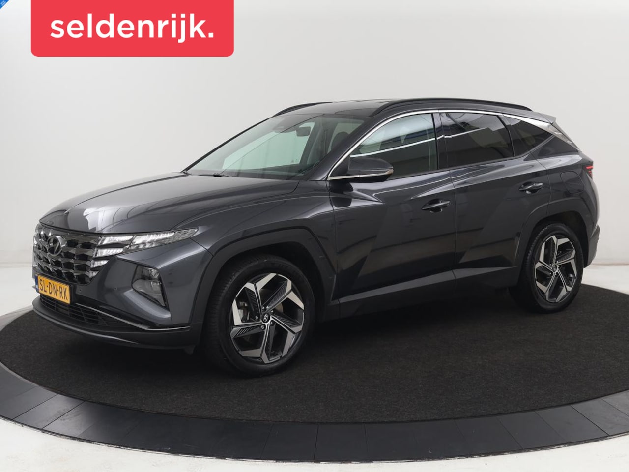 Hyundai Tucson - 1.6 T-GDI PHEV Comfort 4WD | SOH 96% | Stoelverwarming | Trekhaak | Adaptive cruise | Came - AutoWereld.nl
