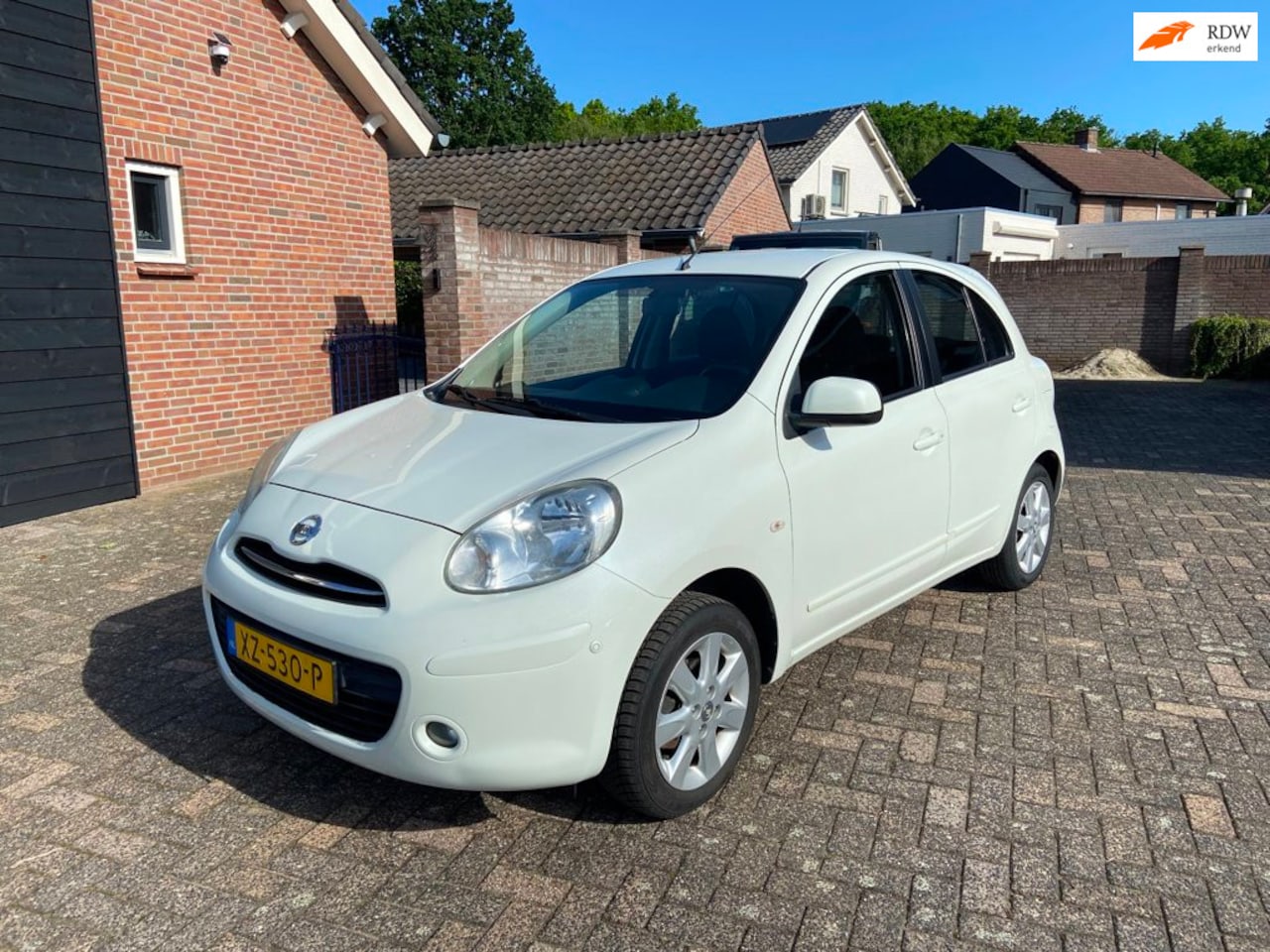 Nissan Micra - 1.2 Visia Parelmoer wit navi/airco/pd.154186 km - AutoWereld.nl