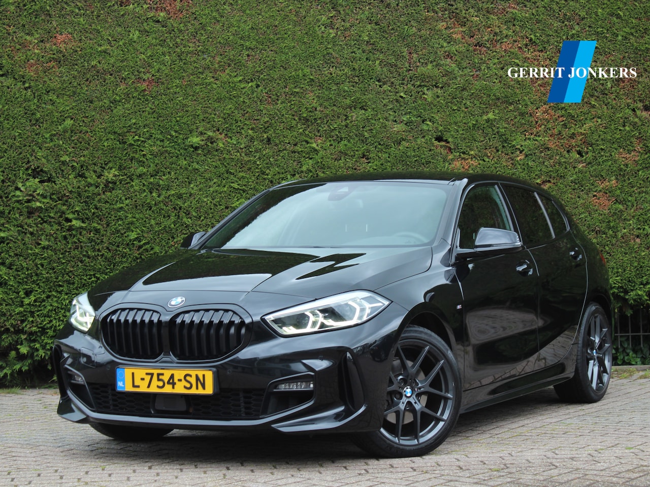 BMW 1-serie - 118i High Executive M Sport | Stoelverwarming | Camera | HUD | Harman kardon - AutoWereld.nl