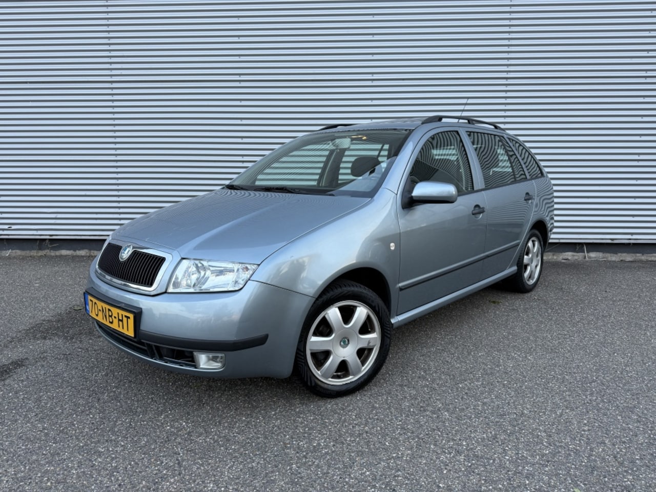 Skoda Fabia Combi - 1.4-16V Elegance Cruise Airco Pano Trekhaak - AutoWereld.nl