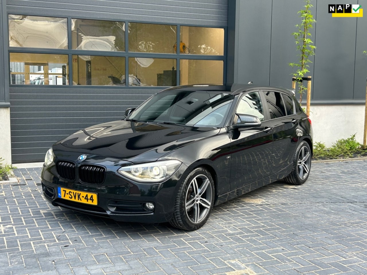 BMW 1-serie - 116i Sport | PDC | Navi | Clima | Cruise | Bluetooth - AutoWereld.nl
