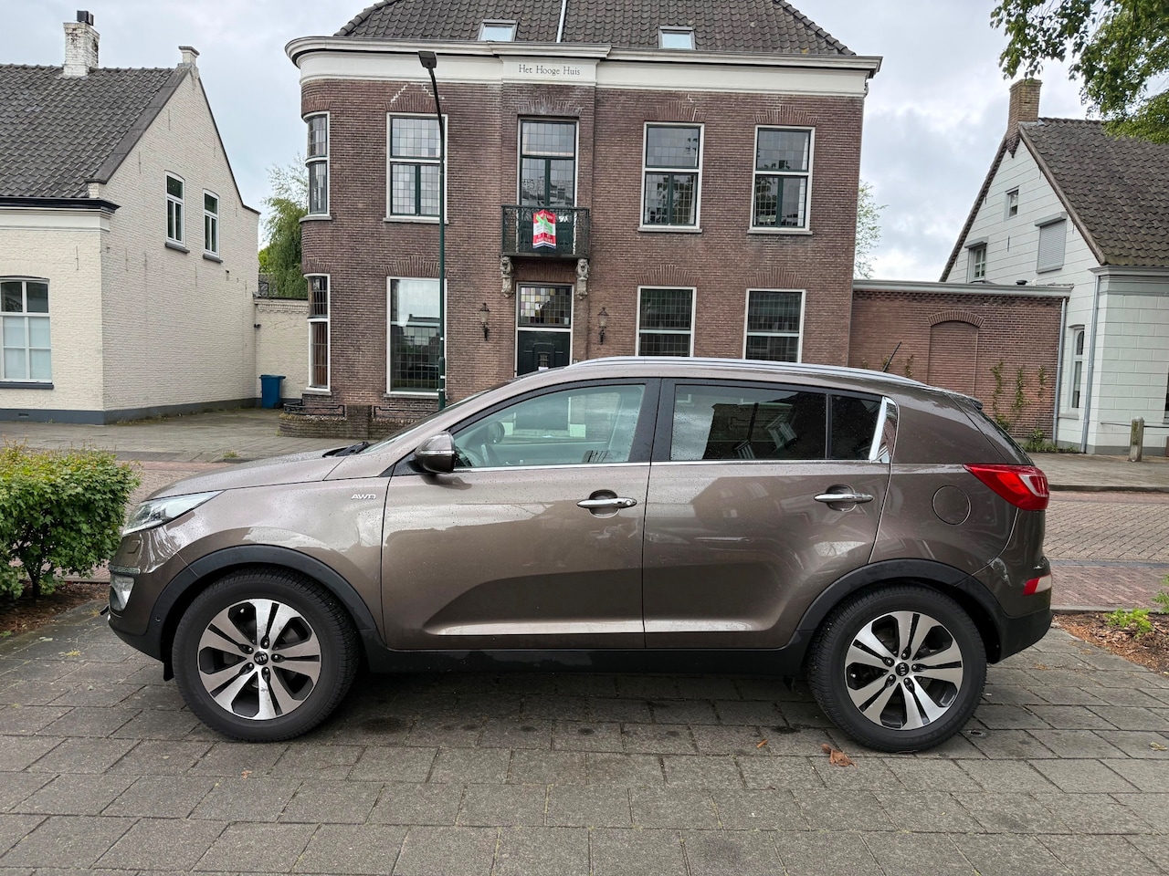 Kia Sportage - 2.0 X-ecutive 4wd Plus Pack AUTOMAAT LEER PANO - AutoWereld.nl
