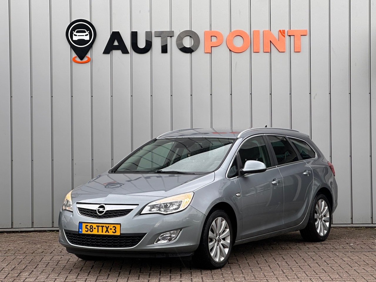 Opel Astra Sports Tourer - 1.4 Turbo Cosmo LEER AIRCO NAVI PDC - AutoWereld.nl