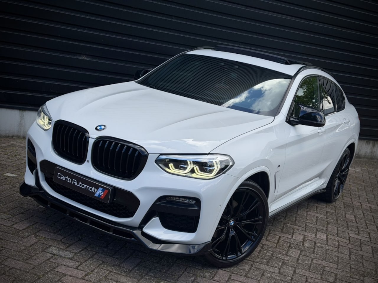BMW X4 - xDrive20i M-PERF. PANO|HUD|360|H/K|THAAK - AutoWereld.nl