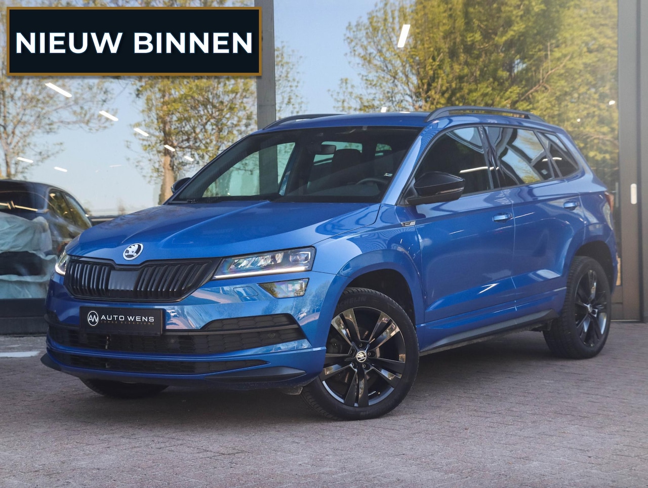 Skoda Karoq - 1.5 TSI ACT Sportline 150PK DSG Adapt. Cruise Race Blue 22.000km! - AutoWereld.nl