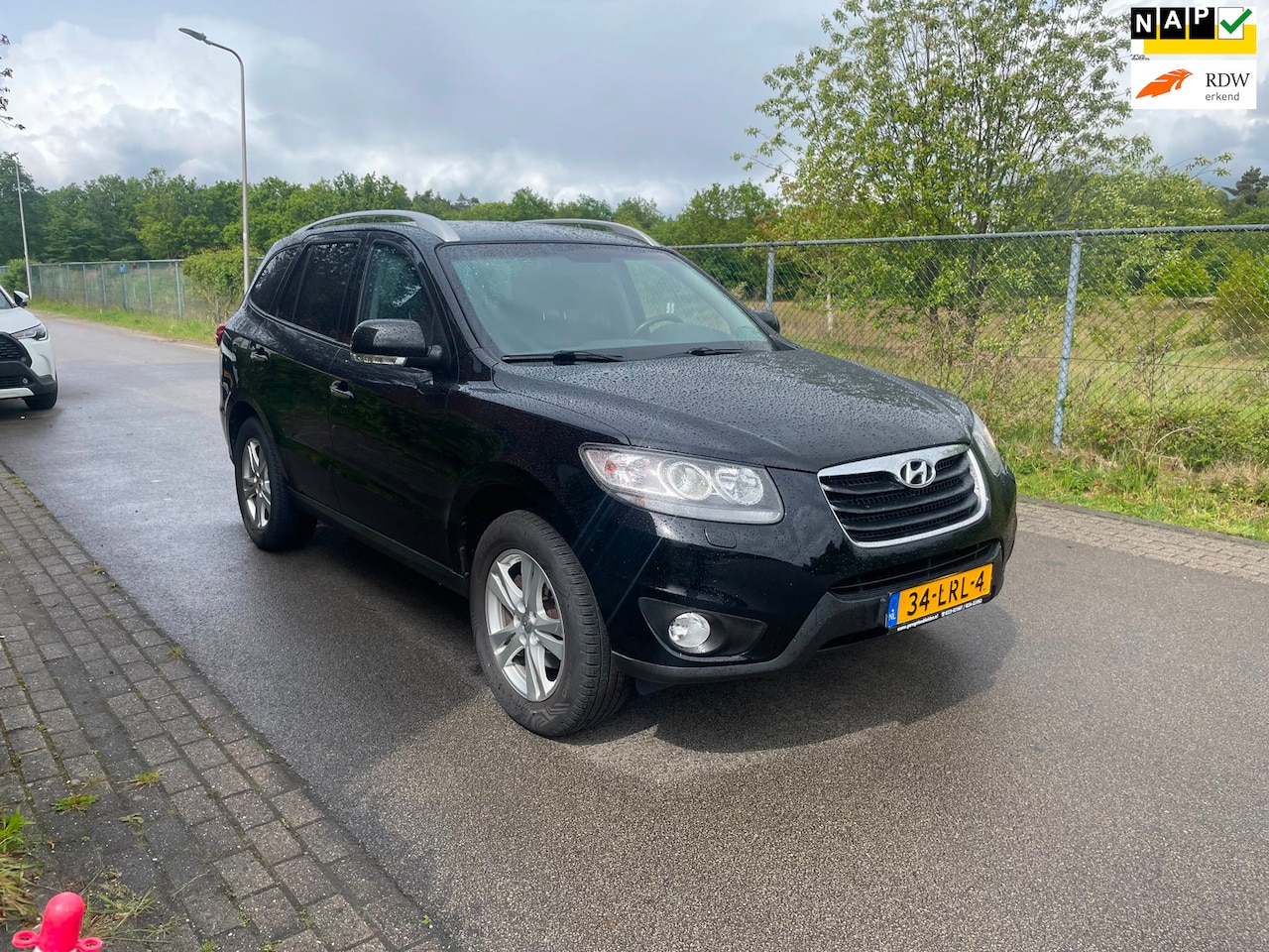 Hyundai Santa Fe - 2.4i CVVT Style 7 pers. 2.4i CVVT Style 7 pers. - AutoWereld.nl