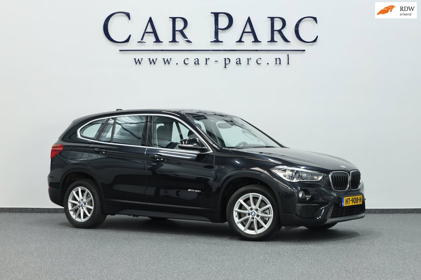 BMW X1 - SDrive20i Essential LED/NAVI/LMV/PDC/CRUISE/ECC/12 MND GARANTIE! - AutoWereld.nl