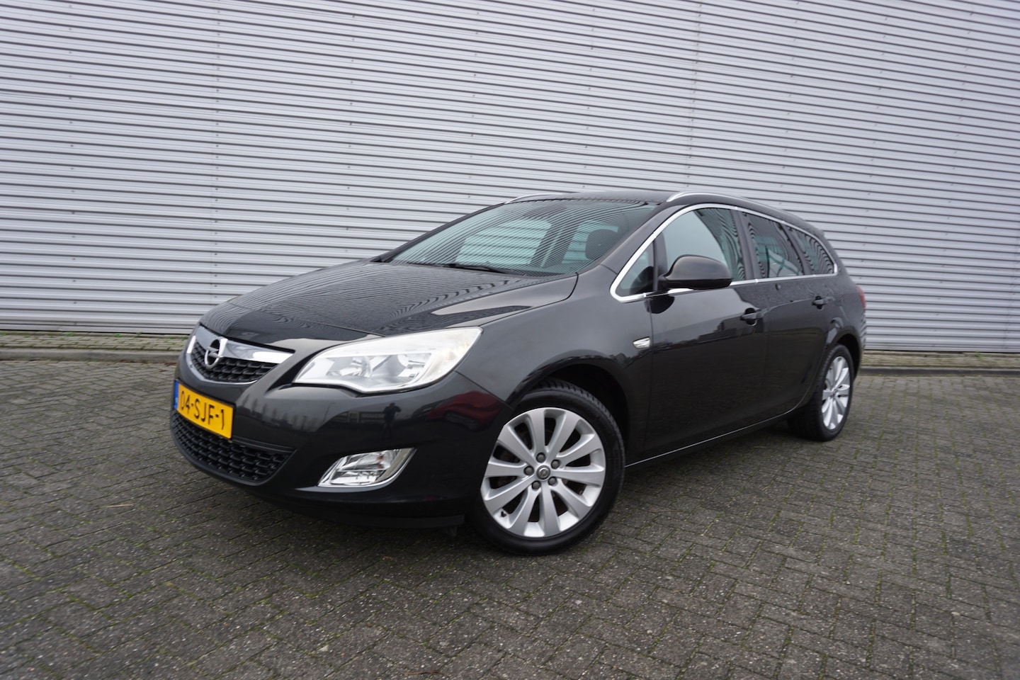 Opel Astra Sports Tourer - 1.4 Cosmo Climate / Navi / Cruise / Parkeersens. / Trekhaak / Lm velgen / NAP - AutoWereld.nl