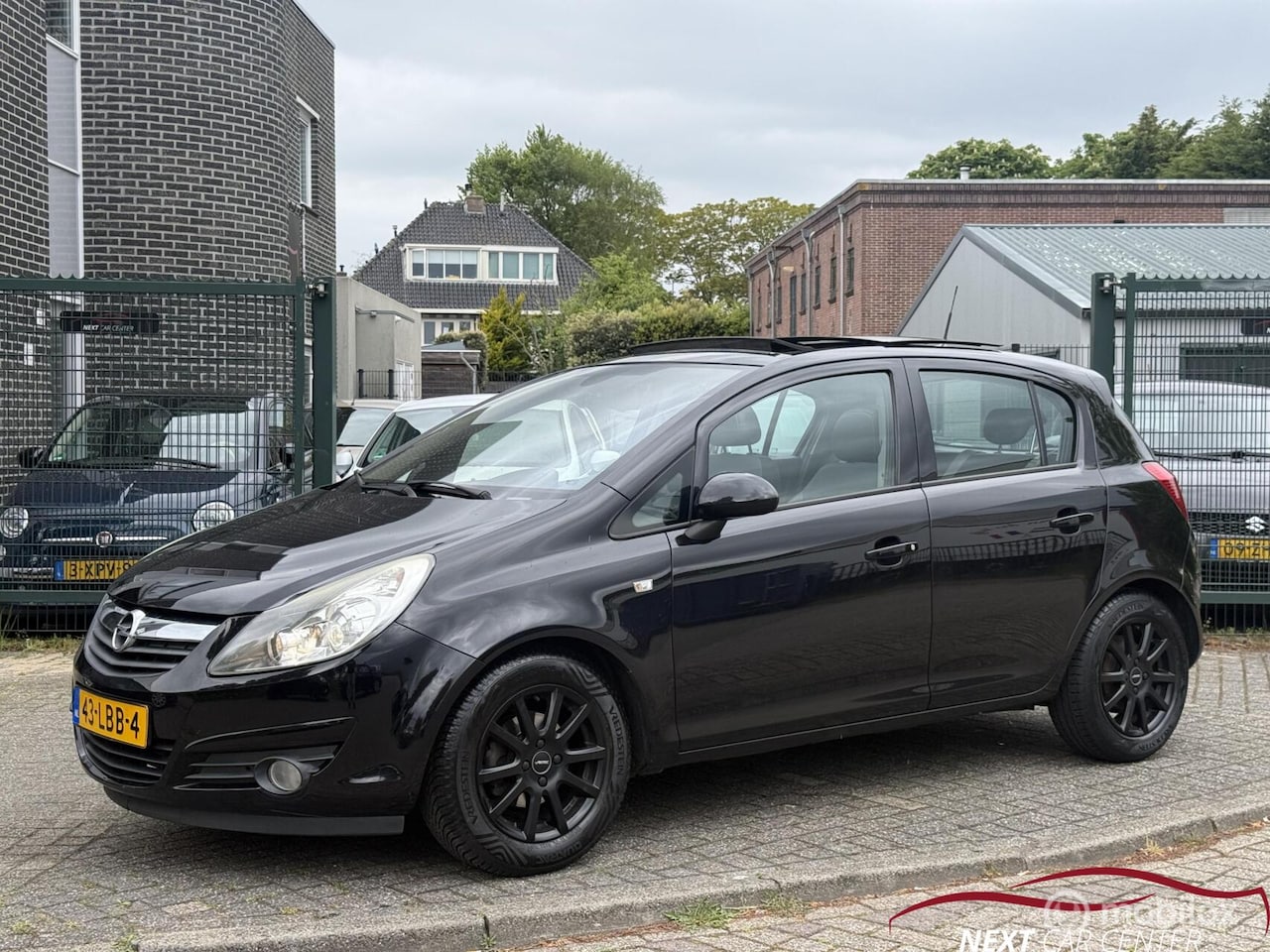 Opel Corsa - 1.4-16V Cosmo Panoramadak / CarPlay - AutoWereld.nl