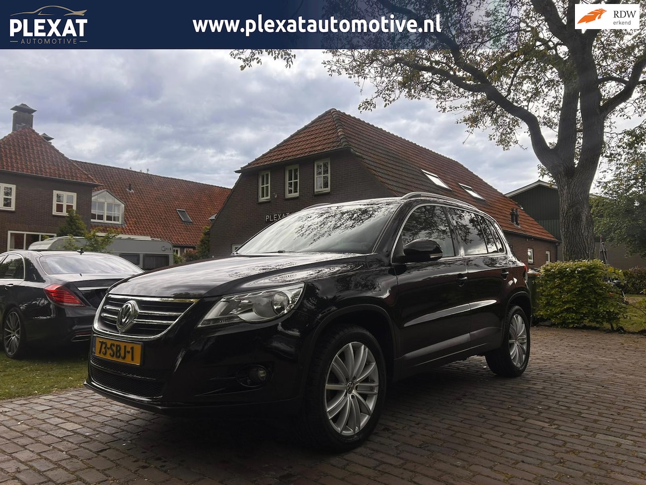 Volkswagen Tiguan - 1.4 TSI Sport&Style | Black optiek | Multimedia | Elek. Trekhaak | Lichtmetaal | PDC | His - AutoWereld.nl