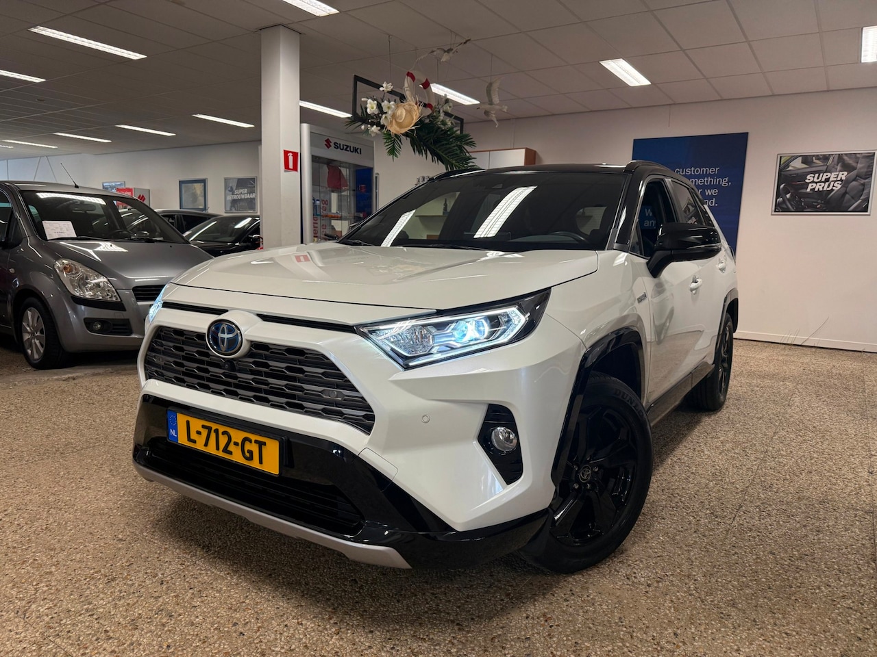 Toyota RAV4 - 2.5 Hybrid Bi-Tone | Automaat| Carplay| 1e eigenaar| NL - AutoWereld.nl