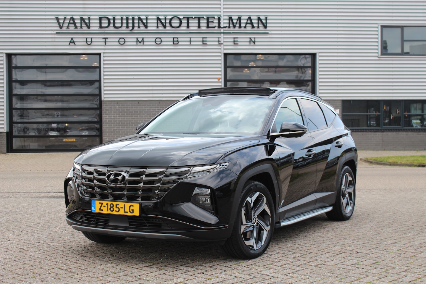 Hyundai Tucson - 1.6 T-GDI PHEV Premium Sky 4WD / Panoramadak / Trekhaak / N.A.P. - AutoWereld.nl
