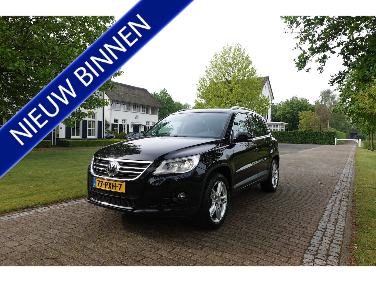 Volkswagen Tiguan - 1.4 TSI Sport&Style | NIEUWE KETTING | Trekhaak | NAVI | Xenon | - AutoWereld.nl