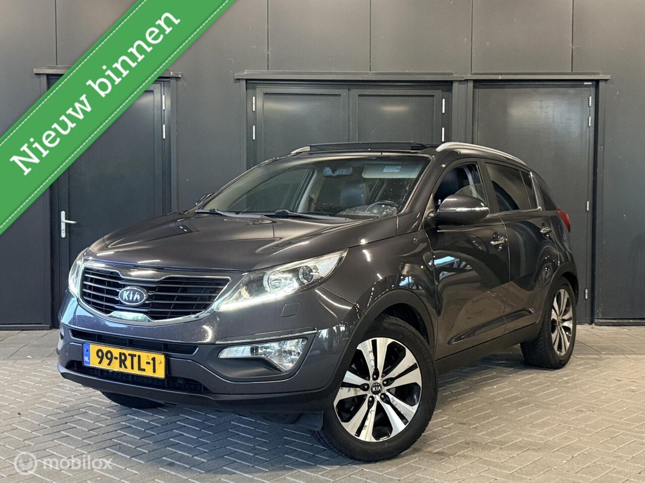 Kia Sportage - 2.0 X-clusive Pano/AUT/stoelverwarming/leder - AutoWereld.nl