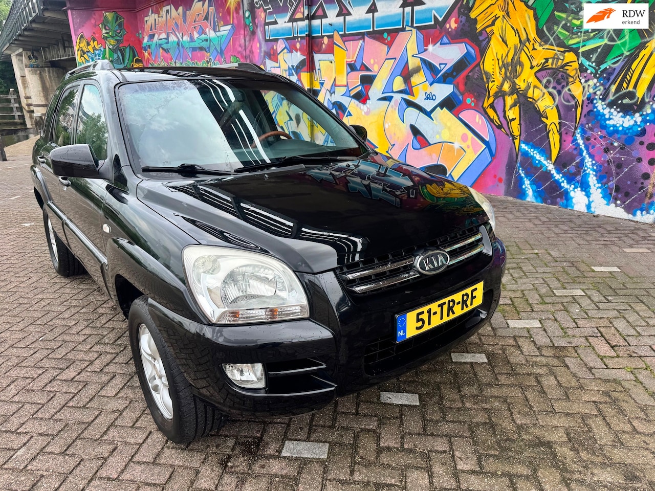 Kia Sportage - 2.0 CVVT M-bition navigatie automatische airco elektrische ramen half leer zeer Leuke comb - AutoWereld.nl