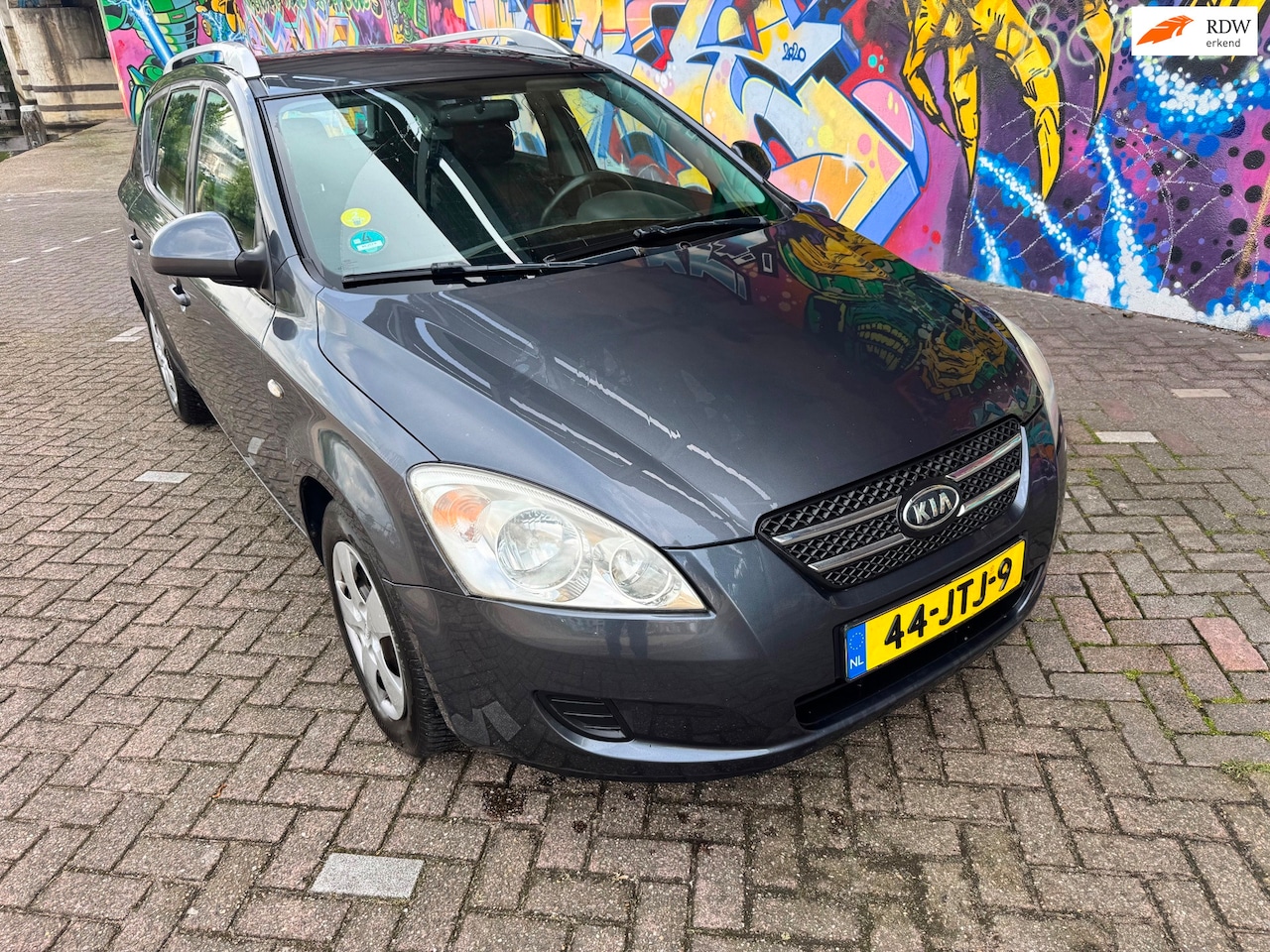 Kia Cee'd Sporty Wagon - 1.4 X-tra ISG nette goed rijdende auto met airco stereo boeken aanwezig lekker ruime auto - AutoWereld.nl