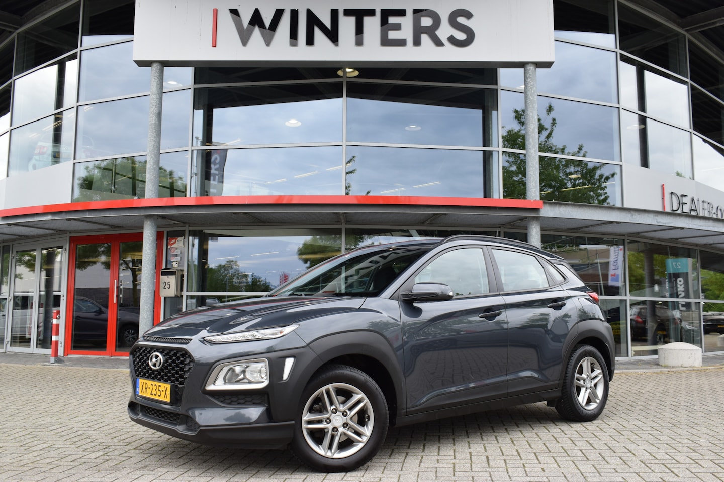 Hyundai Kona - 1.0T Essence | Navigatie | Climate-/ Cruise Control | Camera + Sensoren | - AutoWereld.nl