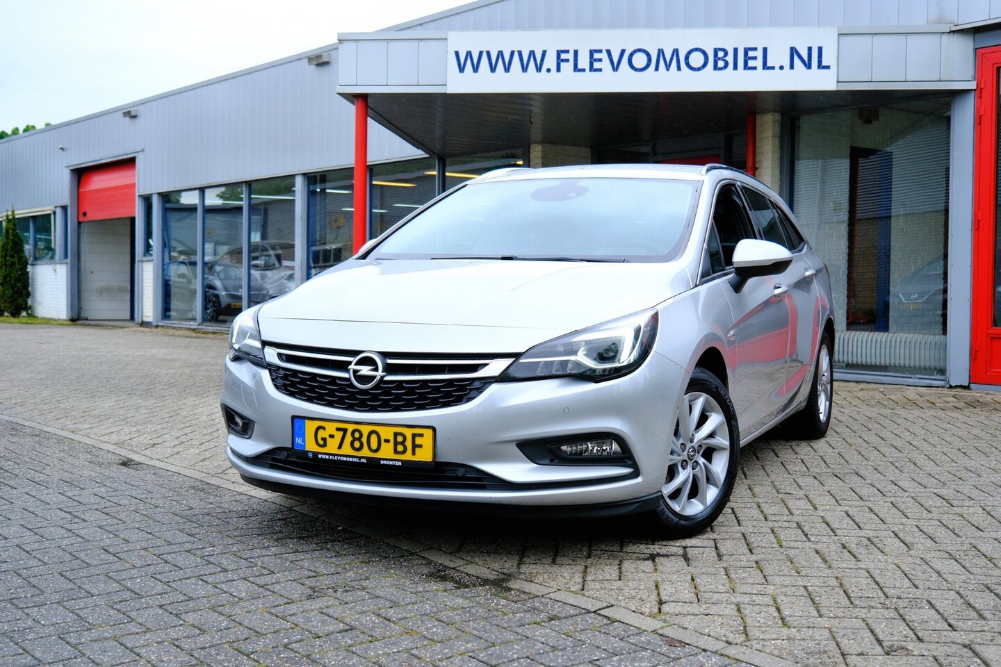 Opel Astra Sports Tourer - 1.4 Innovation *65.000km!* Navi|Half Leder|Cam|ParkAssist - AutoWereld.nl