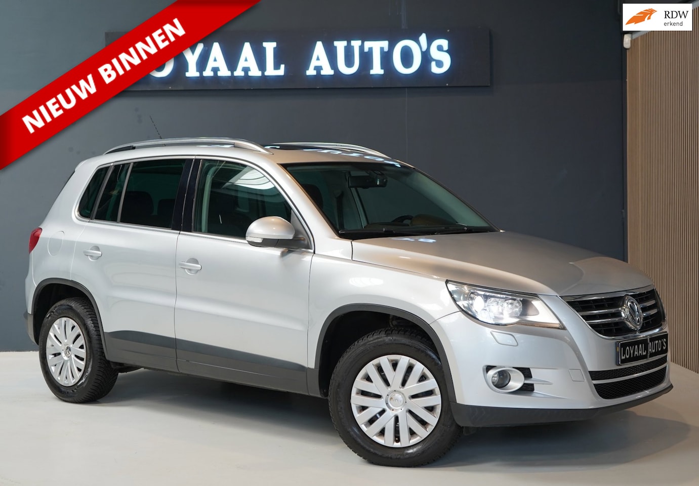 Volkswagen Tiguan - 1.4 TSI Comfort&Design 4Motion |PANO| NAVI | CRUISE | XENON |PDC | APK| TREKHAAK. - AutoWereld.nl