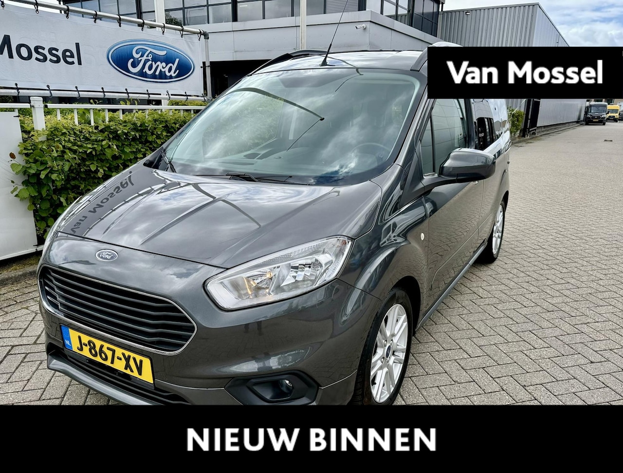 Ford Tourneo Courier - 1.0 100pk Titanium | Navigatie | Stoelverwarming | Climate controle | Lichtmetalen velgen - AutoWereld.nl