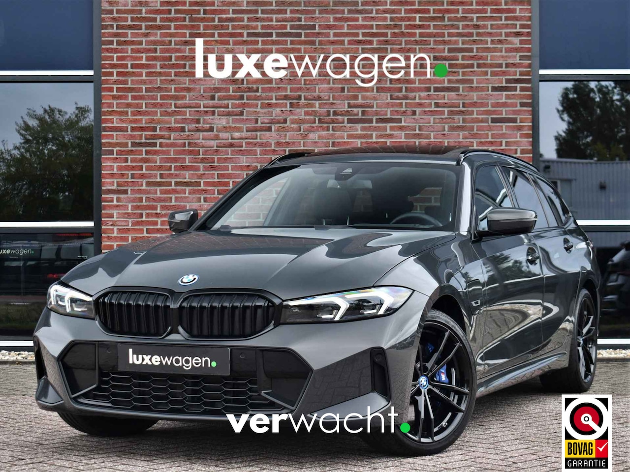 BMW 3-serie Touring - 330e M-Sport Pano ACC H/K El-zetels HUD Dravitgrau 19inch - AutoWereld.nl