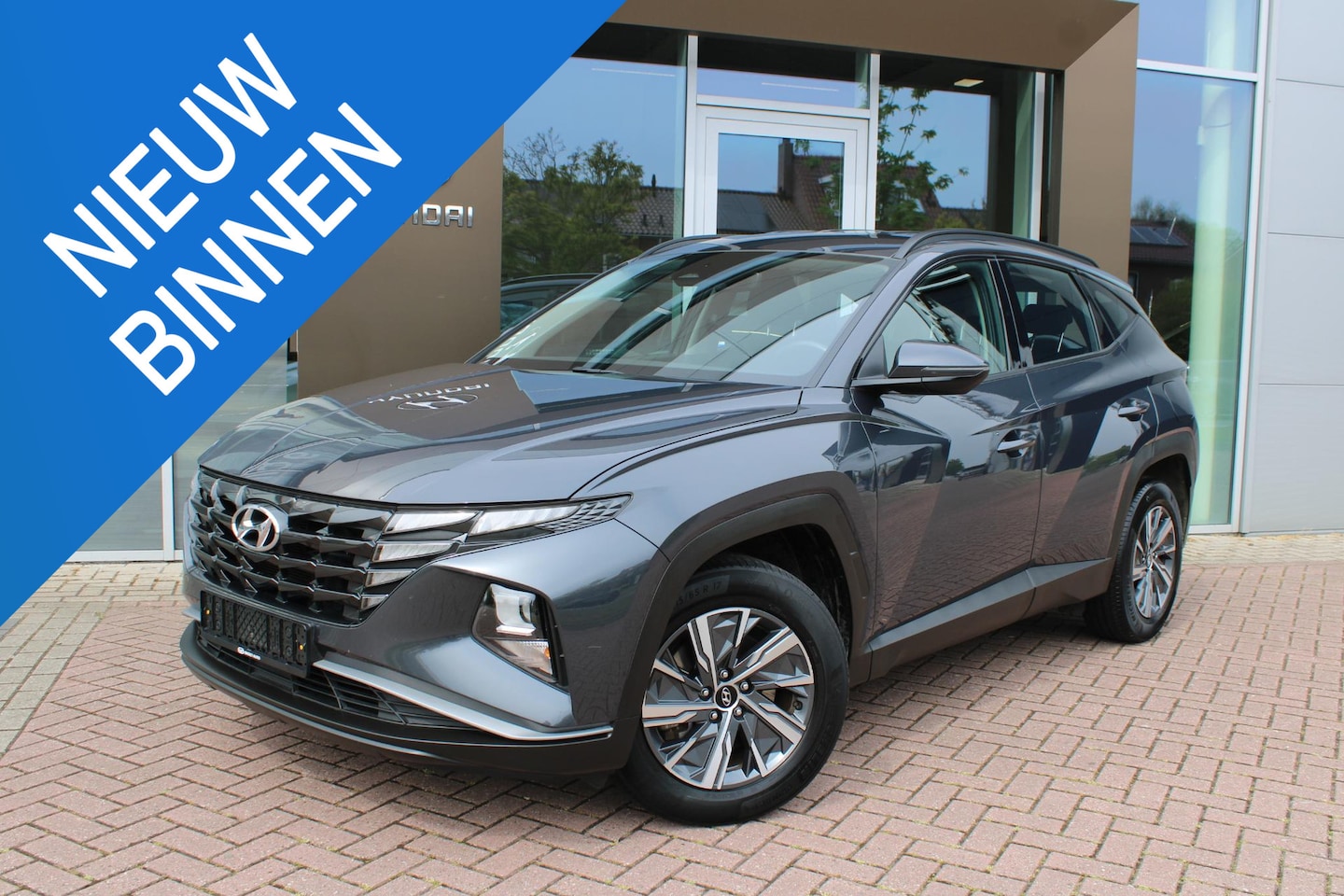 Hyundai Tucson - 1.6 T-GDI 230pk Hybrid Comfort Automaat Airco Navi Camera Carplay Zeer mooi - AutoWereld.nl