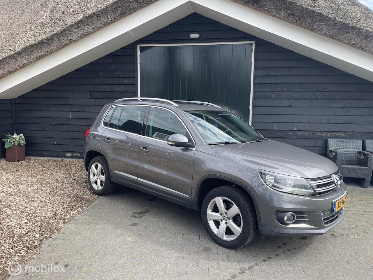 Volkswagen Tiguan - 1.4 TSI Sport&Style - AutoWereld.nl