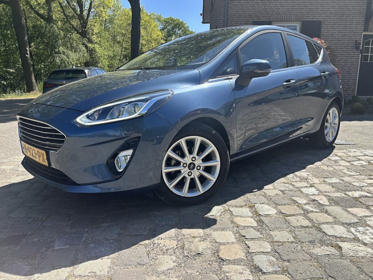 Ford Fiesta - 1.0 95pk Titanium ecc,lmv,navigatie,pdc - AutoWereld.nl