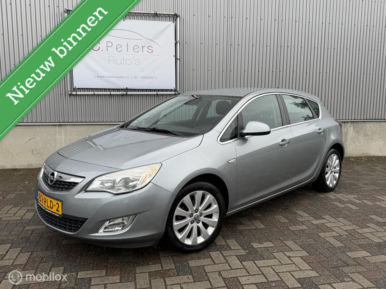 Opel Astra - 1.6 Cosmo 2011 Automaat / Navigatie / Bluetooth / Trekhaak / NAP - AutoWereld.nl