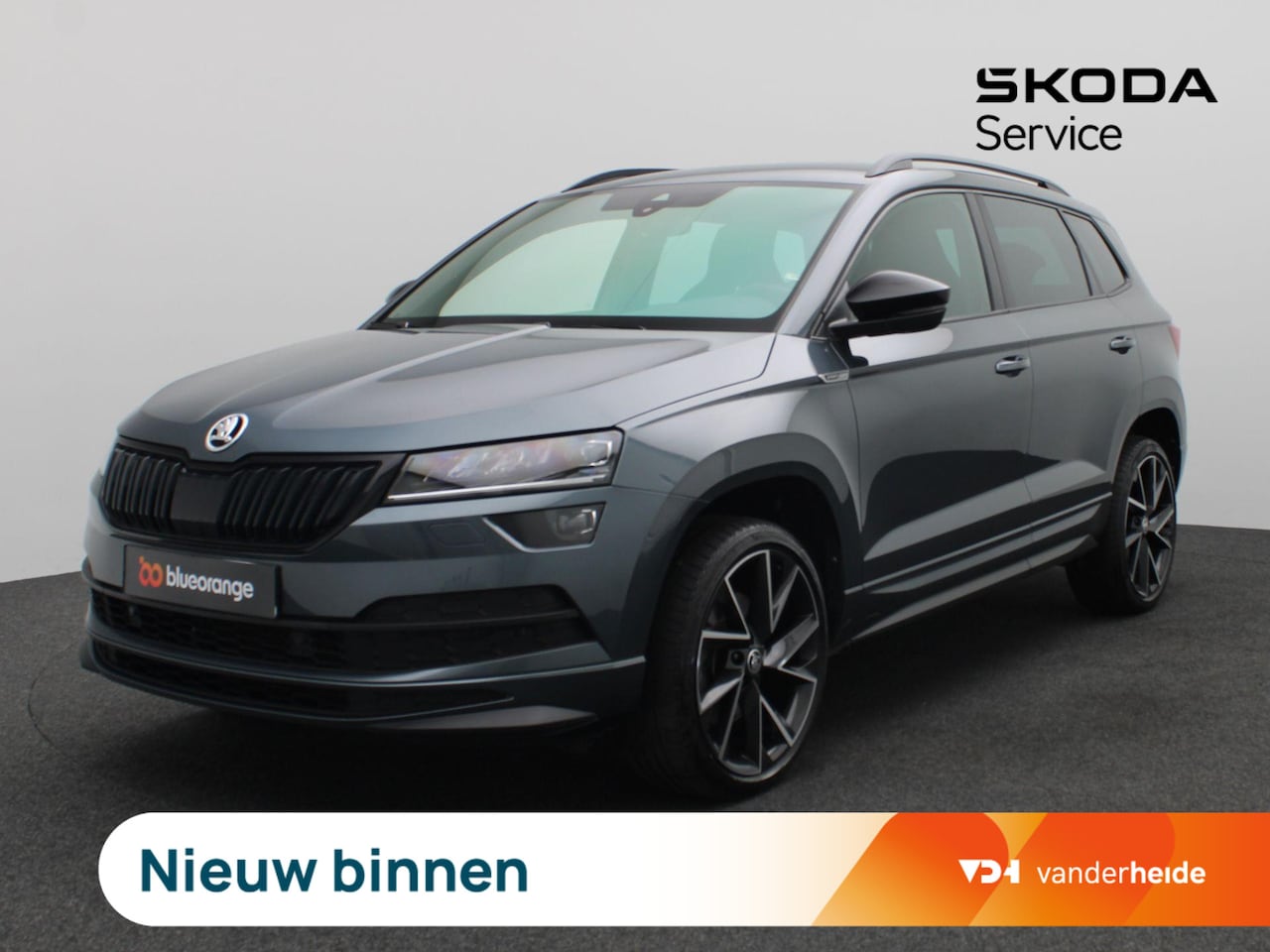 Skoda Karoq - 1.5 TSI ACT Sportline Business 150PK DSG Trekhaak, Achteruitrijcamera, Keyless, 19" LM Vel - AutoWereld.nl