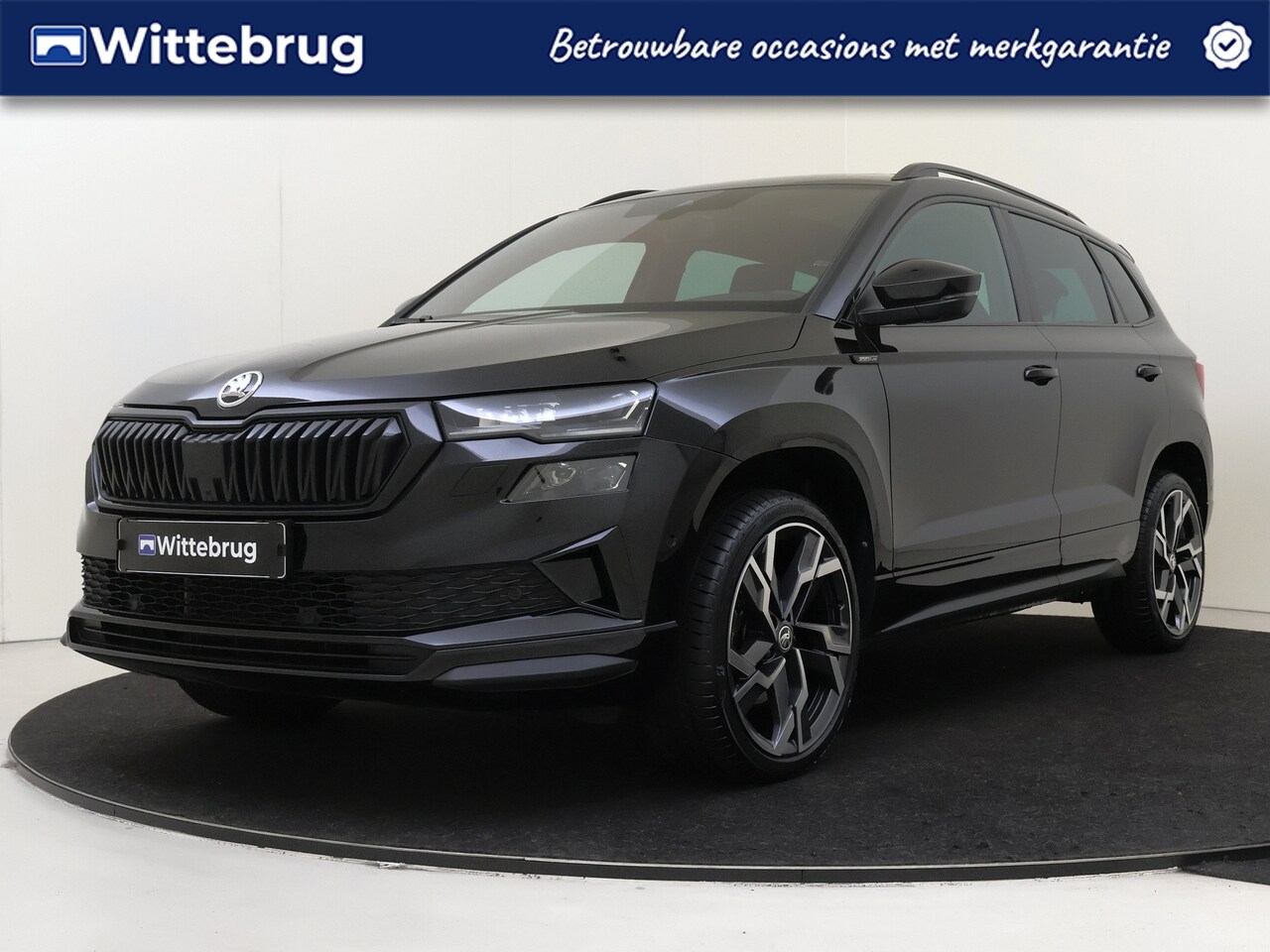 Skoda Karoq - 1.5 TSI ACT Sportline Business OPEN DAK PACK BLACK !!! - AutoWereld.nl