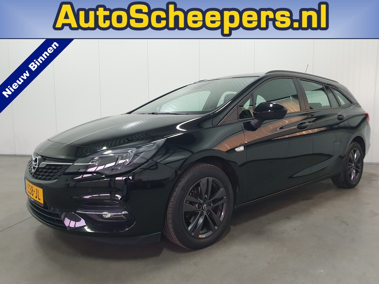 Opel Astra Sports Tourer - 1.2 Edition NAVI/PDC/CRUISE/AIRCO/LMV - AutoWereld.nl