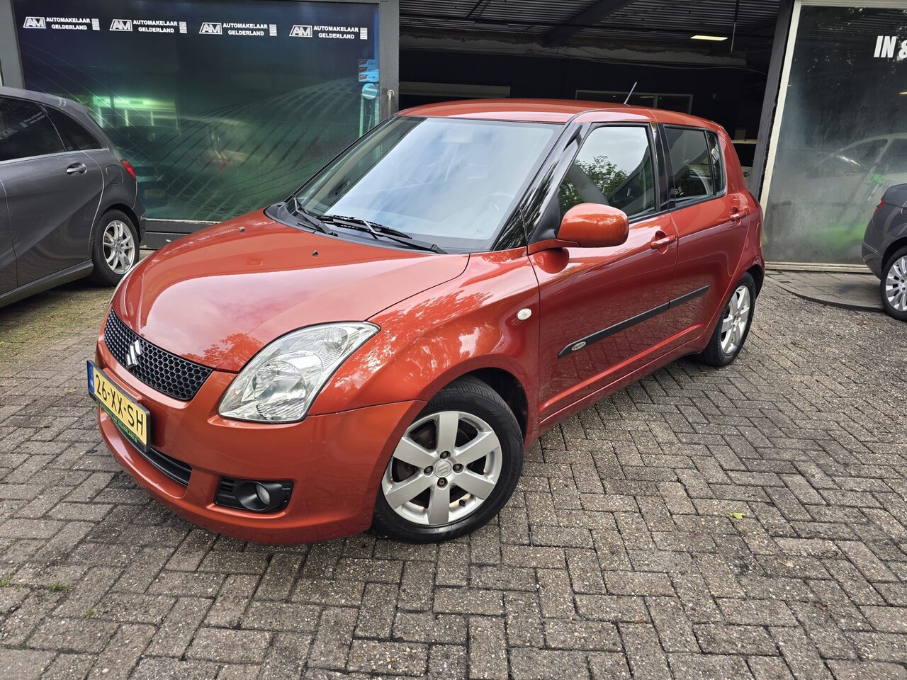 Suzuki Swift - 1.3 Shogun | 12MND GARANTIE | AIRCO | ELEC RAMEN | LMV | NW APK | - AutoWereld.nl