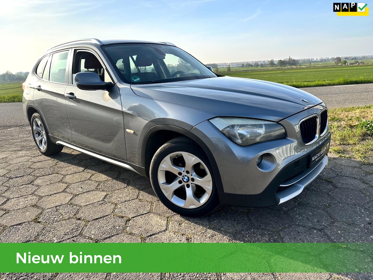 BMW X1 - 18i ACTIE: NU TOT €500 KORTING! | 5DRS| NAP| AIRCO| NAVI| TREKHAAK| APK |VELGEN - AutoWereld.nl