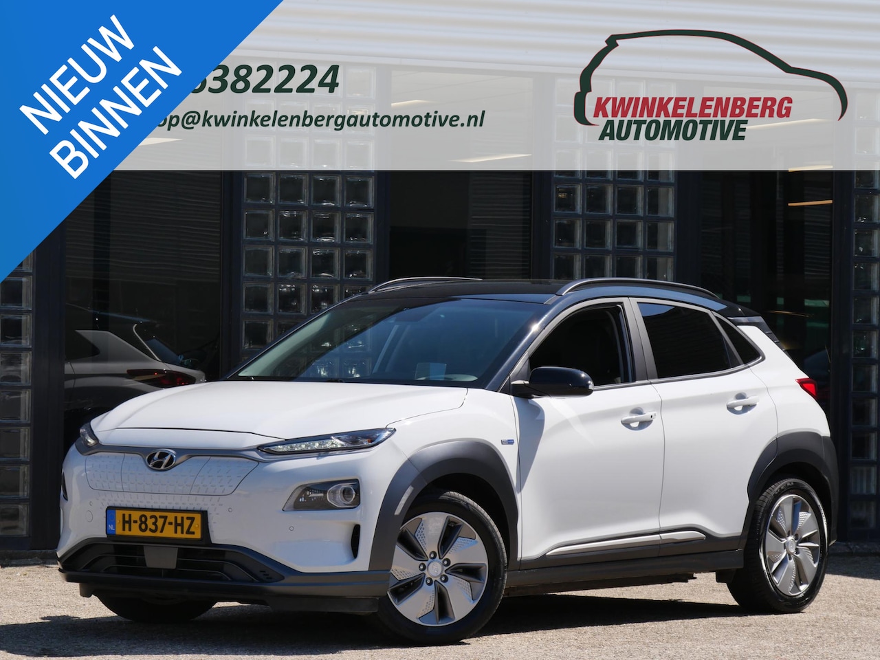 Hyundai Kona Electric - EV 64kWh PREMIUM/ LEER/ TREKHAAK/ TWO-TONE/ SOH 100% - AutoWereld.nl
