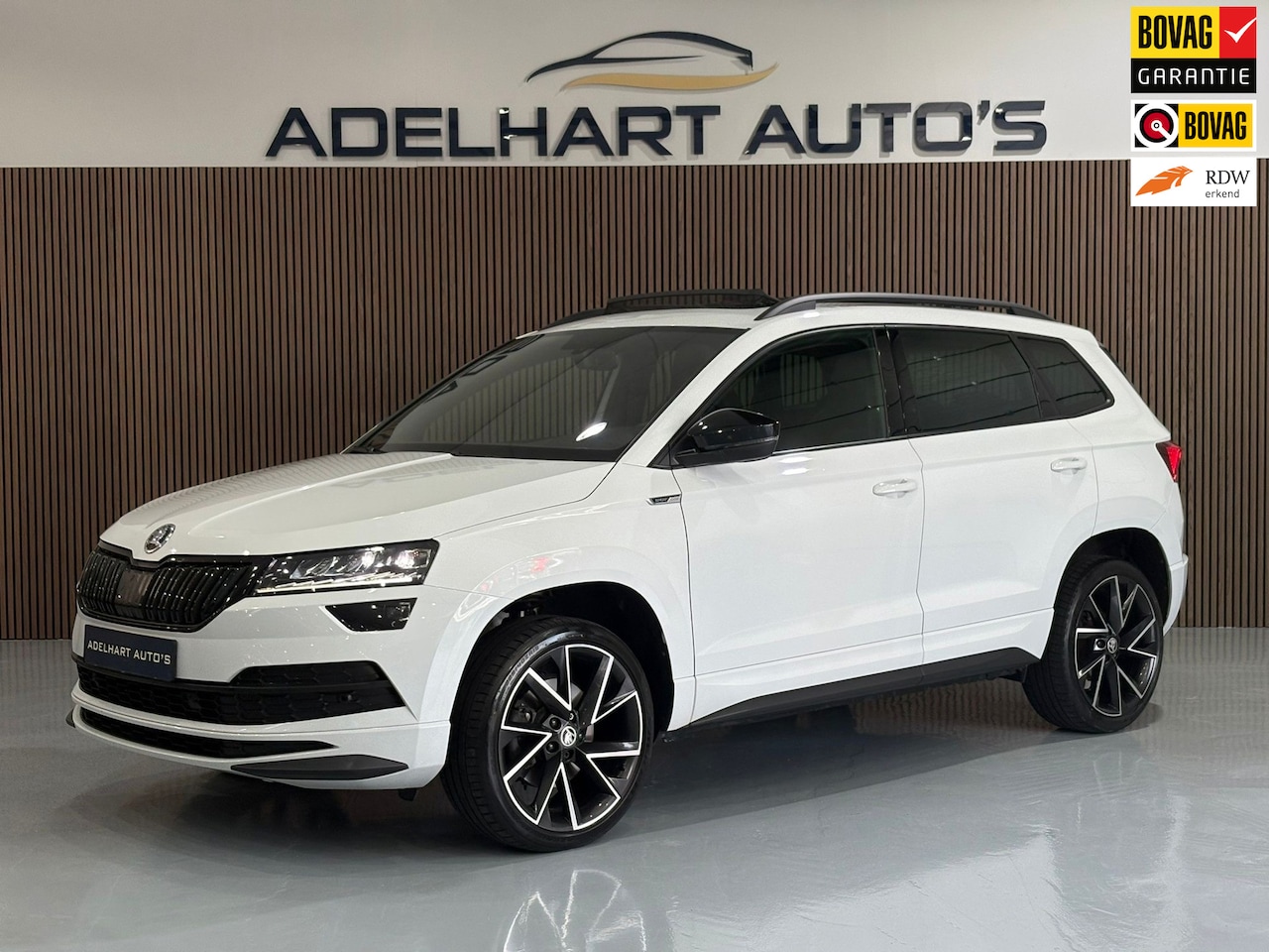 Skoda Karoq - 1.5 TSI ACT Sportline DSG Automaat / Panorama dak / Navigatie full map / Camera / Cruise c - AutoWereld.nl