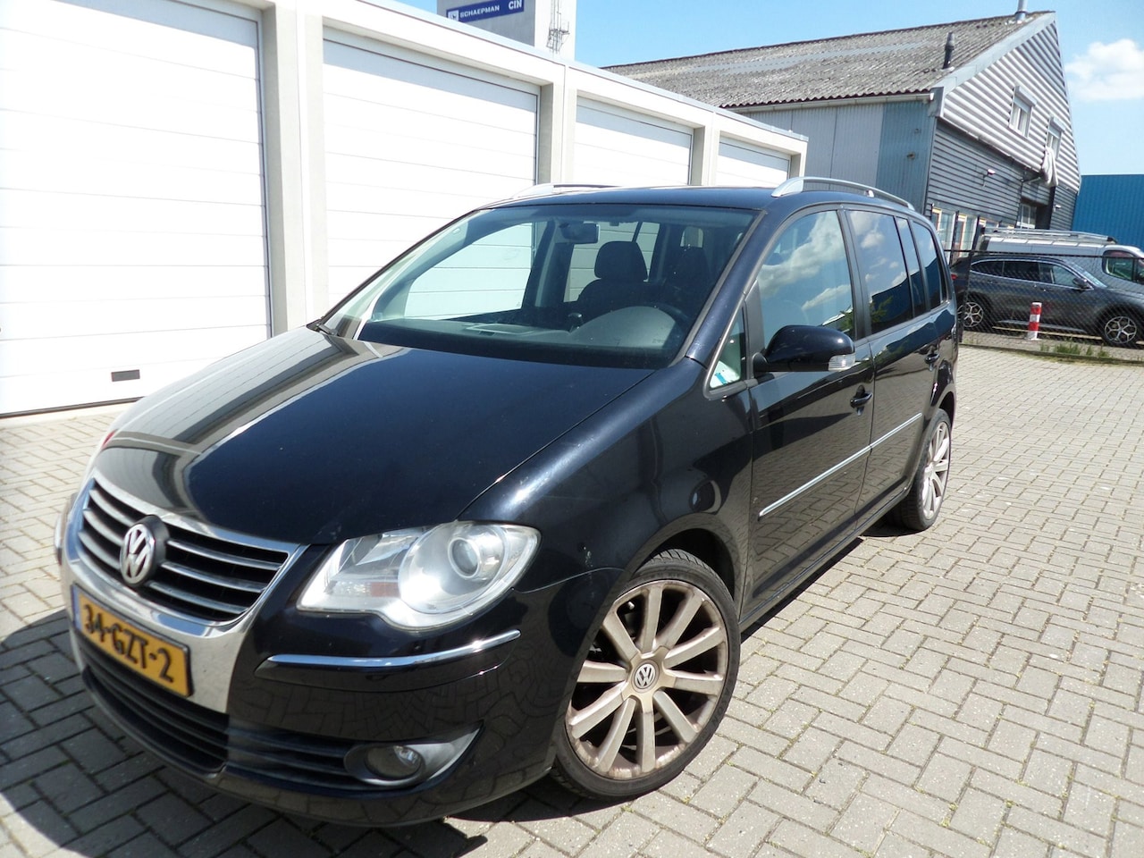 Volkswagen Touran - 1.4 TSI Highline Business 7 Persoons auto - AutoWereld.nl